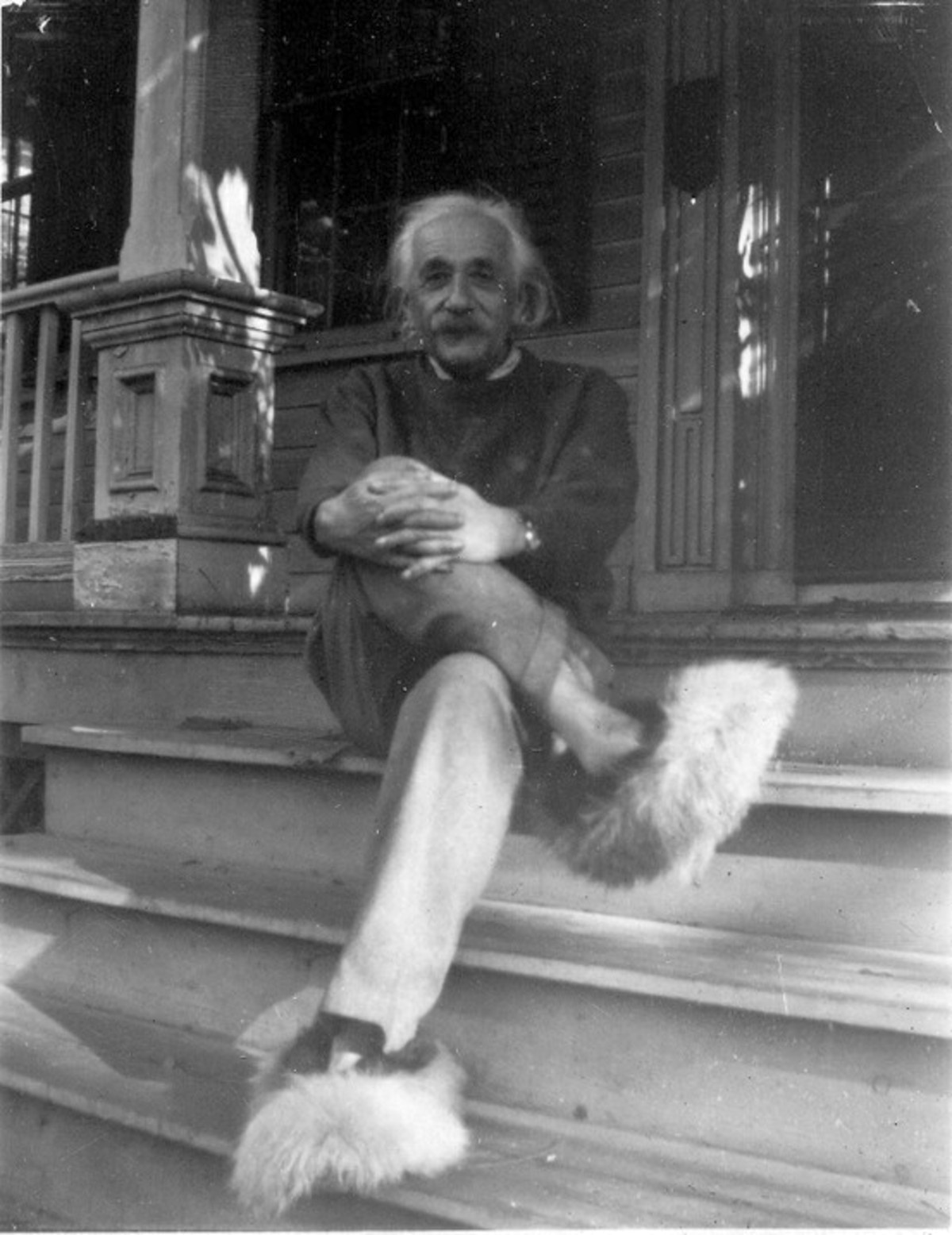 Albert Einstein wearing fuzzy shoes