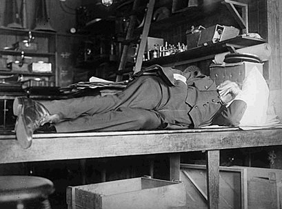 Thomas Edison taking a nap in laboratory