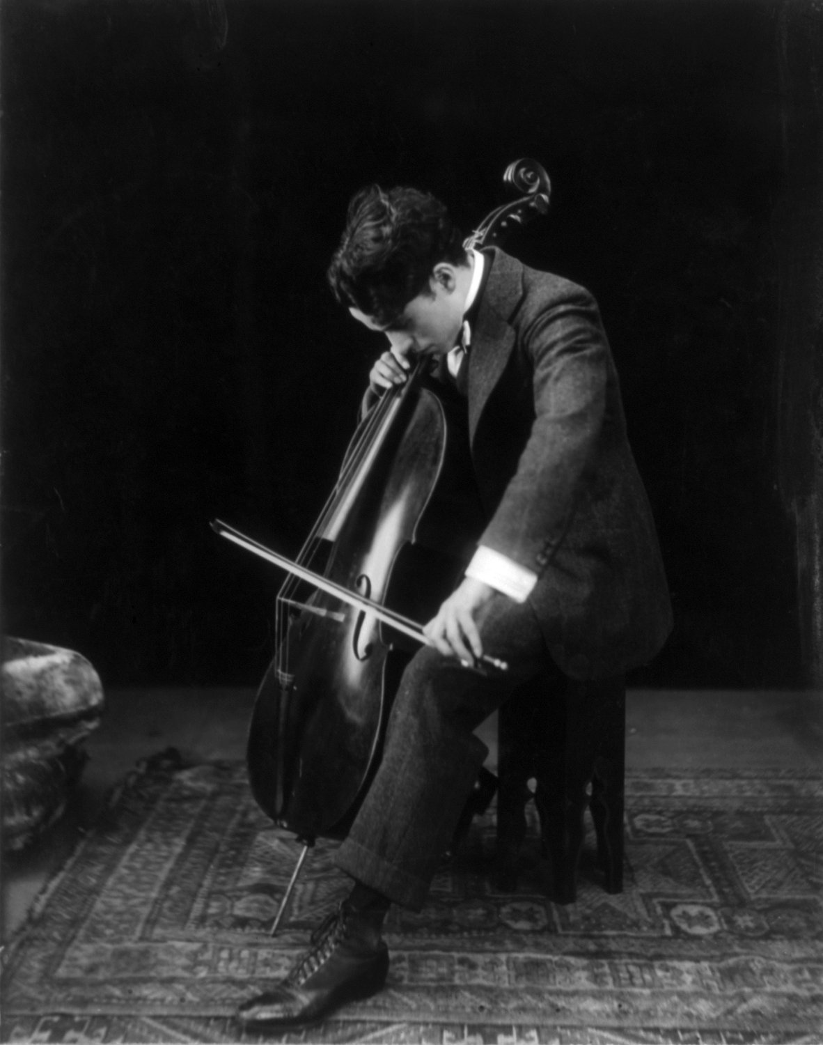Charlie Chaplin playing the cello in 1915